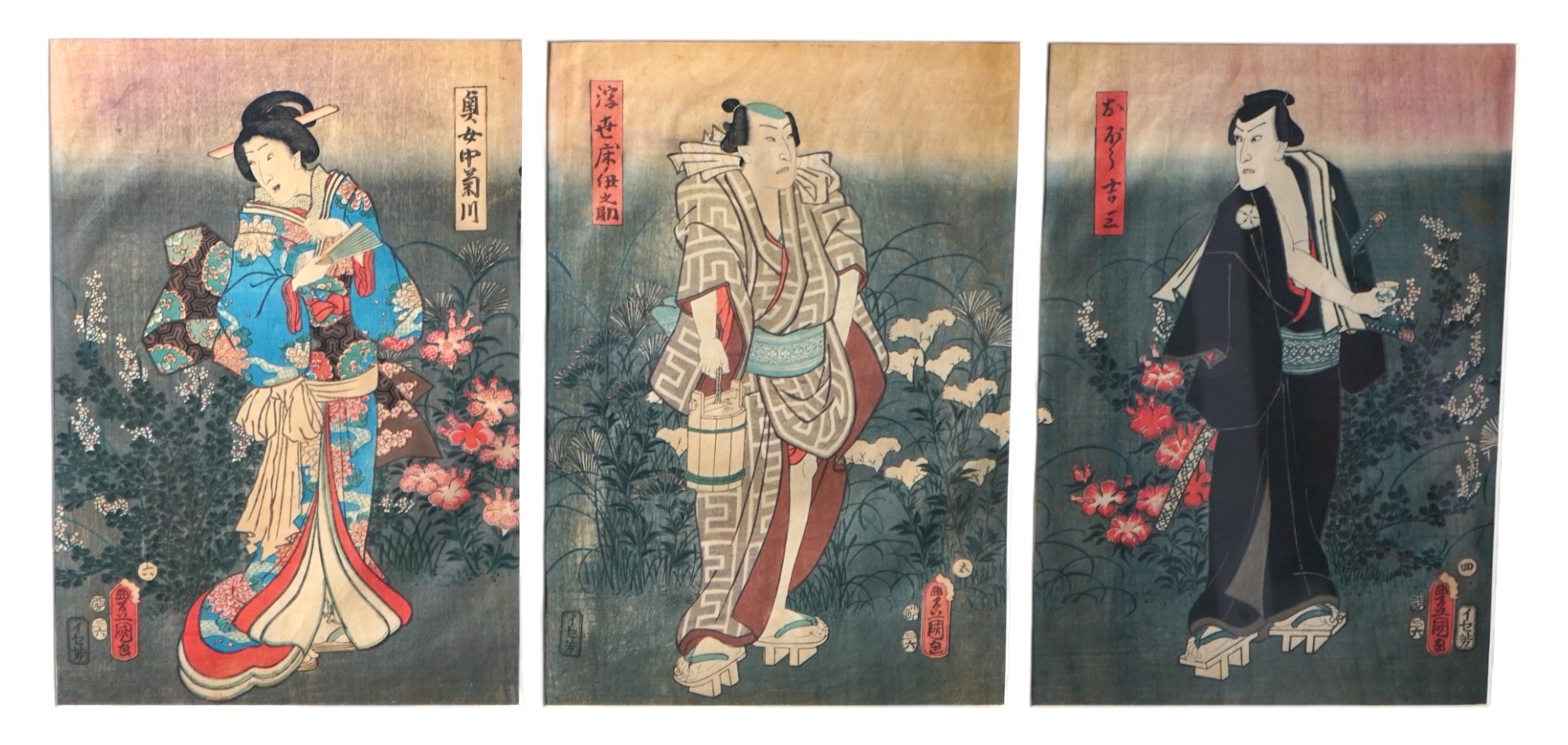 Kunisada Toyokuni III (1786-1864), woodblock tryptych, Three actors standing in gardens, each 35 x 24cm. Condition - possibly some paper discolouration but not laid down, margins covered by the mount